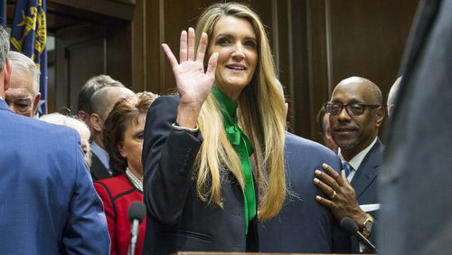 12/04/2019 -- Atlanta, Georgia -- Newly appointed U.S. Senator Kelly Loeffler waves toward supporters following a press conference in the Governor's office at the Georgia State Capitol Building, Wednesday, December 4, 2019.  Georgia Gov. Brian Kemp appointed Kelly Loeffler to the U.S. Senate to take the place of U.S. Senator Johnny Isakson, who is stepping down for health reasons. (ALYSSA POINTER/ALYSSA.POINTER@AJC.COM)