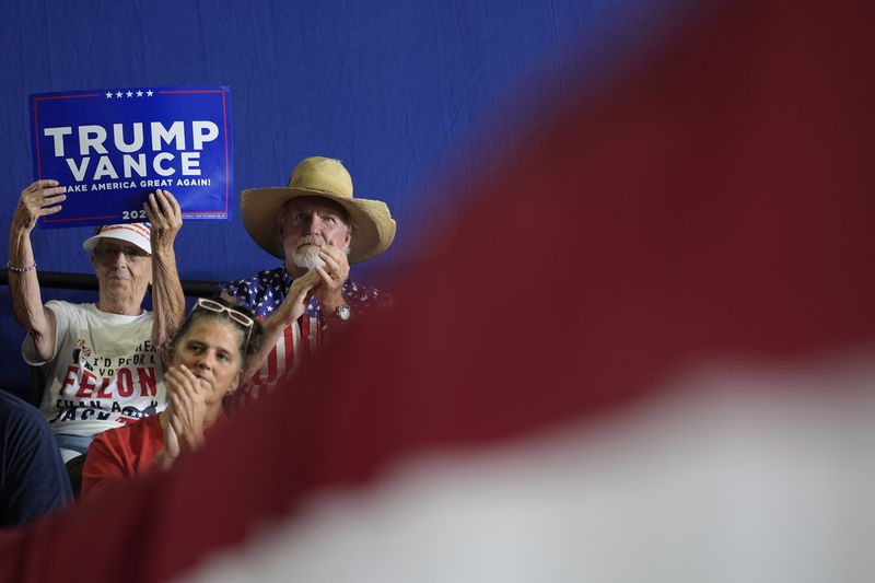 Attendees listen to republican vice presidential nominee Sen. JD Vance, R-Ohio, speak at a campaign event, Tuesday, Sept. 17, 2024 in Eau Claire, Wis. (AP Photo/Abbie Parr)