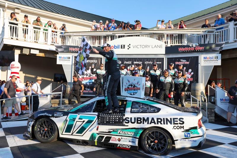 Chris Buescher (17) celebrates winning a NASCAR Cup Series auto race, Sunday, Sept. 15, 2024, in Watkins Glen, N.Y. (AP Photo/Lauren Petracca)