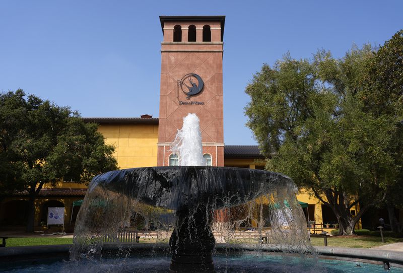 The DreamWorks logo is featured on a clock tower at the DreamWorks Animation campus, Wednesday, Sept. 25, 2024, in Glendale, Calif. (AP Photo/Chris Pizzello)