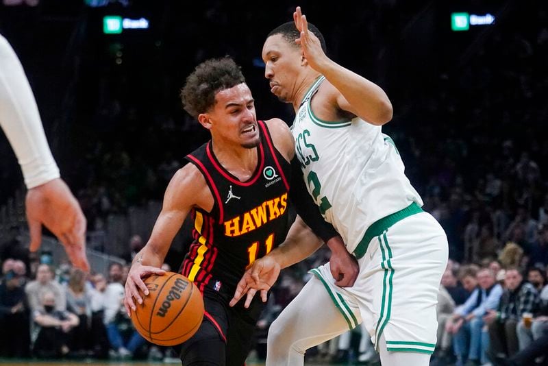 Hawks guard Trae Young tries to get past Celtics forward Grant Williams during the second half Tuesday night in Boston. (AP Photo/Charles Krupa)