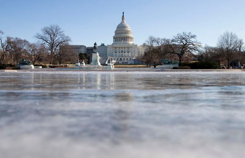 The reflecting pool in front of the U.S. Capitol building in Washington.  The House and Senate are in recess. (Evan Vucci /AP)