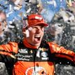 Ross Chastain celebrates in Victory Lane after winning a NASCAR Cup Series auto race at Kansas Speedway in Kansas City, Kan., Sunday, Sept. 29, 2024. (AP Photo/Colin E. Braley)