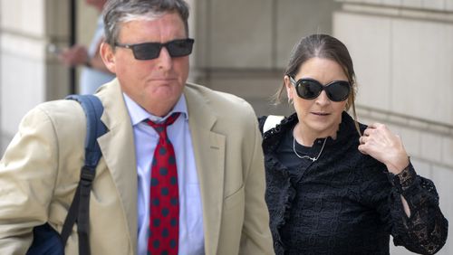 Kellye SoRelle, former general counsel for the Oath Keepers, right, and her attorney Horatio Aldredge leave federal court in Washington, Wednesday, Aug. 21, 2024. (AP Photo/Mark Schiefelbein)