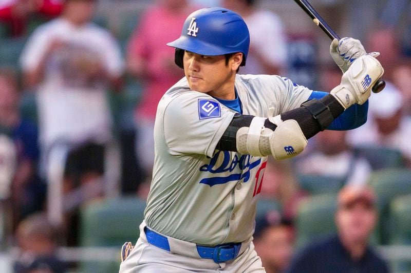 Los Angeles Dodgers' Shohei Ohtani watches the pitch in the first inning of a baseball game against the Atlanta Braves, Saturday, Sept. 14, 2024, in Atlanta. (AP Photo/Jason Allen)