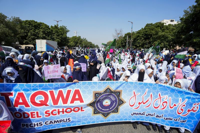 School children take part in a rally organized by Pakistan Markazi Muslim League party, to protest against Israeli airstrikes and to show solidarity with Palestinian people living in Gaza and Lebanon, in Karachi, Pakistan, Monday, Oct. 7, 2024. (AP Photo/Fareed Khan)