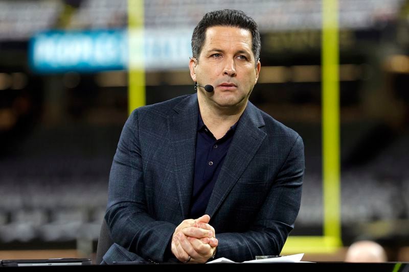 FILE - ESPN Monday Night Football commentator Adam Schefter is seen on set before an NFL football game between the New Orleans Saints and the Baltimore Ravens, Monday, Nov. 7, 2022, in New Orleans. (AP Photo/Tyler Kaufman, File)