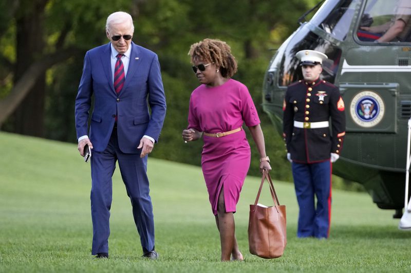 FILE - President Joe Biden walks across the South Lawn of the White House as he talks with White House press secretary Karine Jean-Pierre May 2, 2024, in Washington, after returning from a trip to North Carolina. (AP Photo/Mark Schiefelbein, File)