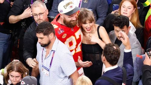 Kansas City Chiefs tight end Travis Kelce (87) and Taylor Swift celebrate the Chiefs' victory over the San Francisco 49ers in Super Bowl LVIII on Sunday, Feb. 11, 2024, at Allegiant Stadium in Las Vegas. (Bizuayehu Tesfaye/Las Vegas Review-Journal/TNS)