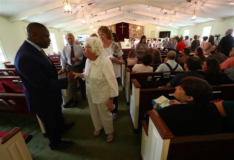 Reverend Tony Lowden greets visitors and members in the sanctuary of Maranatha Baptist Church following the worship service on June 9. Lowden has previouly pastored at Strong Tower Fellowship and served as youth pastor at Lundy Chapel Missionary Baptist Church in Macon. His wife Pilar is a dance instructor in Macon.