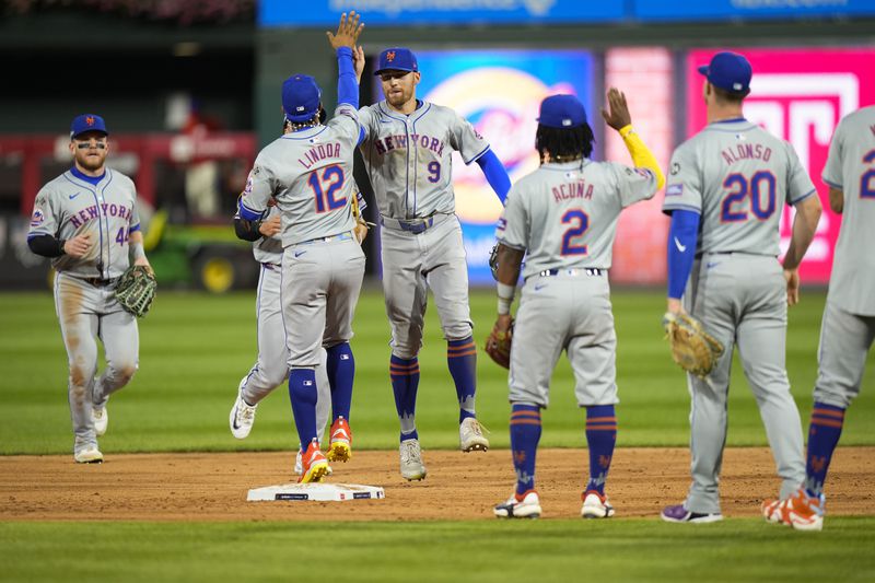 The New York Mets celebrate after winning Game 1 of a baseball NL Division Series against the Philadelphia Phillies, Saturday, Oct. 5, 2024, in Philadelphia. (AP Photo/Chris Szagola)