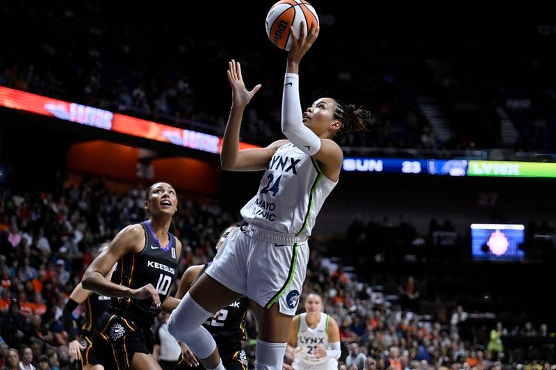 Minnesota Lynx forward Napheesa Collier (24) shoots as Connecticut Sun forward Olivia Nelson-Ododa (10) defends during the first half of a WNBA basketball semifinal game, Friday, Oct. 4, 2024, in Uncasville, Conn. (AP Photo/Jessica Hill)