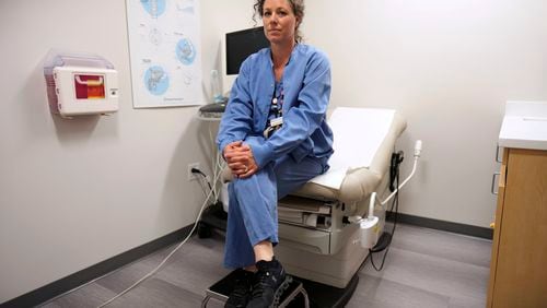 Dr. Sarah Traxler, Planned Parenthood North Central States' chief medical officer, poses for a photo in the ultrasound room at the Planned Parenthood clinic, Thursday, July 18, 2024, in Ames, Iowa. Iowa's strict abortion law goes into effect Monday, July 29, 2024, banning most abortions after about six weeks of pregnancy and before many women know they are pregnant. (AP Photo/Charlie Neibergall)