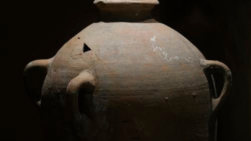 A rare bronze-era jar, newly reassembled, returned to public exhibition after a four-year-old accidentally broke the jar in August during a visit in Hecht Museum of the University of Haifa, Israel, on Wednesday, Sept. 11, 2024. (AP Photo/Mahmoud Illean)