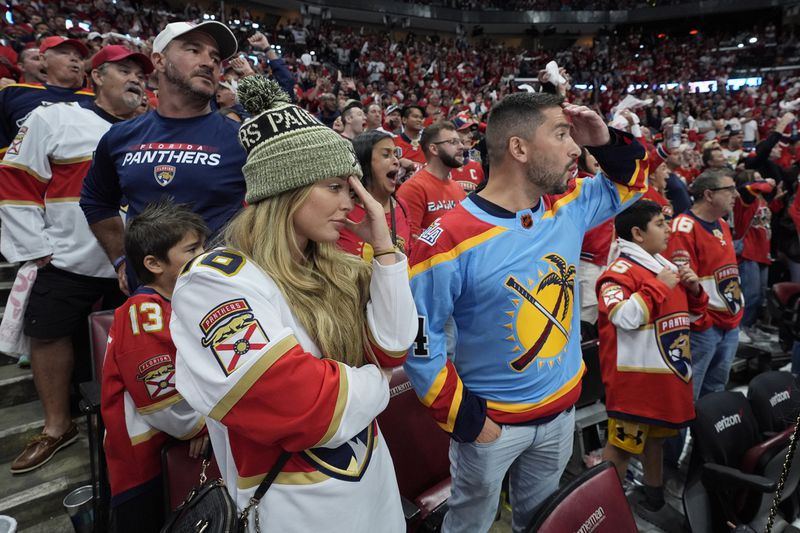 Florida Panthers fans react at the end of Game 5 of the NHL hockey Stanley Cup Finals against the Edmonton Oilers, Tuesday, June 18, 2024, in Sunrise, Fla. The Oilers defeated the Panthers 5-3. (AP Photo/Wilfredo Lee)
