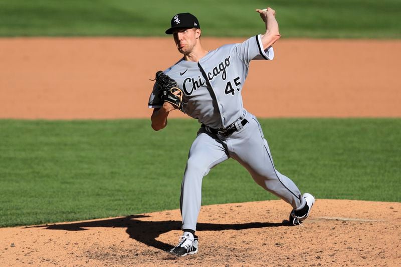 FILE - Chicago White Sox' Garrett Crochet throws during a baseball game against the Cincinnati Reds in Cincinnati, Sunday, Sept. 20, 2020. (AP Photo/Aaron Doster, File)