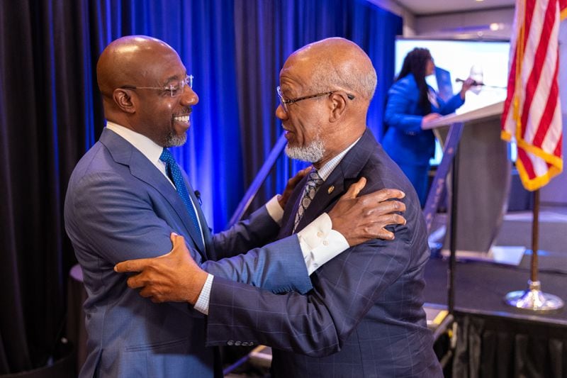 (L-R) U.S. Sen. Raphael Warnock, D-Ga., greets Former state representative Calvin Smyre after speaking at the Georgia delegation breakfast at the Hyatt Regency in Chicago on Monday, August 19, 2024, the first day of the Democratic National Convention. (Arvin Temkar / AJC)