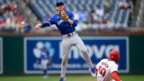 Washington Nationals' Darren Baker (10) is out at second base as Kansas City Royals shortstop Bobby Witt Jr., left, throws to first but is unable to get Nationals' Luis Garcia Jr. who reached safely during the eighth inning of a baseball game, Thursday, Sept. 26, 2024, in Washington. (AP Photo/Nick Wass)