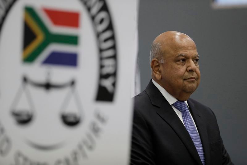 FILE - South Africa's Public Enterprises Minister Pravin Gordhan appears at the judicial commission of inquiry into state capture in Johannesburg, South Africa, on Nov. 19, 2018. (AP Photo/Themba Hadebe)