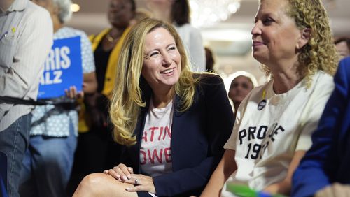 Former Rep. Debbie Mucarsel-Powell of Florida, center, now a Democratic candidate for the U.S. Senate, center, and Rep. Debbie Wasserman Schultz of Florida, right, help kick off a national "Reproductive Freedom Bus Tour" by the campaign of Democratic presidential nominee Vice President Kamala Harris and running mate Gov. Tim Walz, Tuesday, Sept. 3, 2024, in Boynton Beach, Fla. (AP Photo/Rebecca Blackwell)