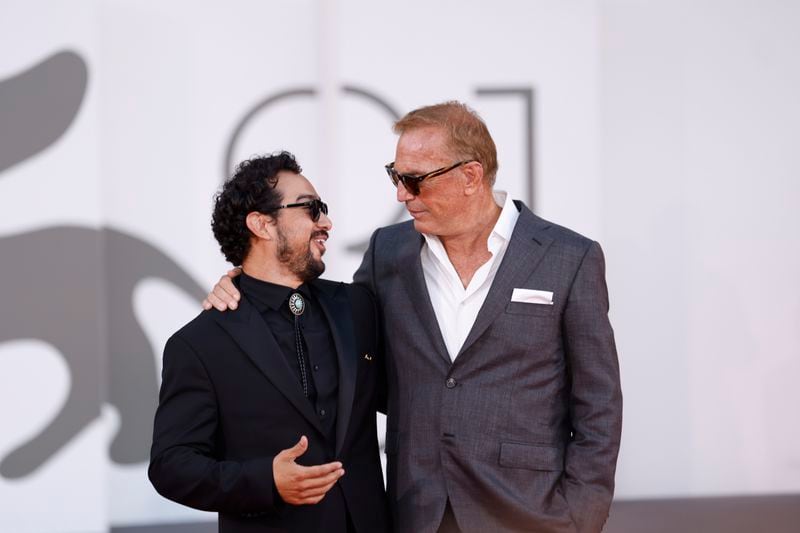 Alejandro Edda, left, and Kevin Costner pose for photographers upon arrival at the closing ceremony of the 81st edition of the Venice Film Festival in Venice, Italy, on Saturday, Sept. 7, 2024(Photo by Vianney Le Caer/Invision/AP)