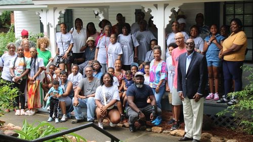 Descendants of former slaves, Jacob and Taressa Jackson, meet Madison Mayor Fred Perriman at the Morgan County African-American Museum. (Photo Courtesy of Emily Whitten)
