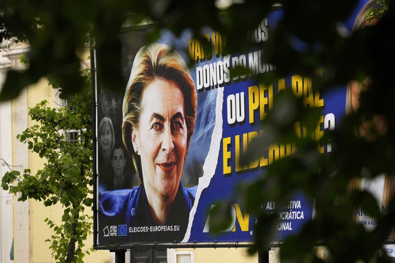 A picture of the European Commission president Ursula von der Leyen, with red eyes, is displayed on a European election campaign billboard of a minor Portuguese populist party, in Lisbon, Thursday, June 6, 2024. The National Democratic Alternative, ADN, has so far failed to elect any member of parliament in Portugal. (AP Photo/Armando Franca)