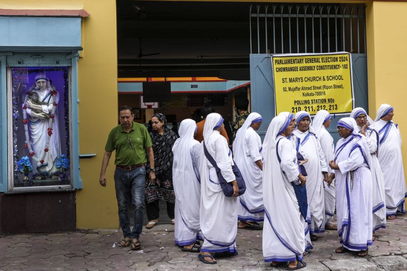 Nuns of the Missionaries of Charity, the order founded by Saint Teresa, gather outside a polling station to cast their votes during the last round of a six-week-long national election, in Kolkata, India, Saturday, June 1, 2024. Indians began voting Saturday in the last round of a six-week-long national election that is a referendum on Hindu nationalist Prime Minister Narendra Modi’s decade in power. (AP Photo/Bikas Das)