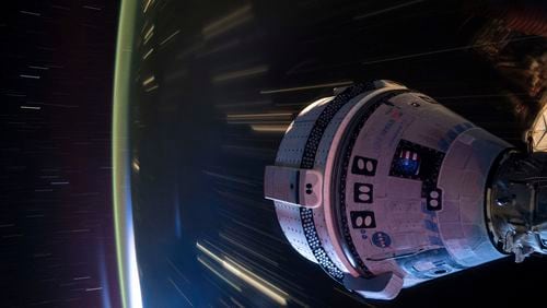 In this long-exposure photo provided by NASA, Boeing's Starliner spacecraft is docked to the Harmony module of the International Space Station on July 3, 2024. (NASA via AP)