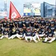 The Braves pose for a team photograph after earning a spot in the playoffs by beating the Mets 3-0 in the second game of the doubleheader at Truist Park on Monday, Sept. 30, 2024, in Atlanta. 
(Miguel Martinez/ AJC)