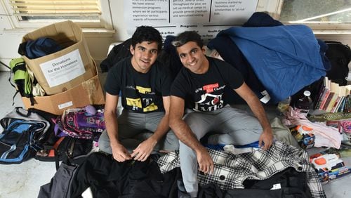 When Nitish Sood, left, and his brother Aditya founded Working Together for Change in 2013, they were hoping to create a space for dialogue about homelessness while addressing needs of the homeless population around metro Atlanta. HYOSUB SHIN / HSHIN@AJC.COM