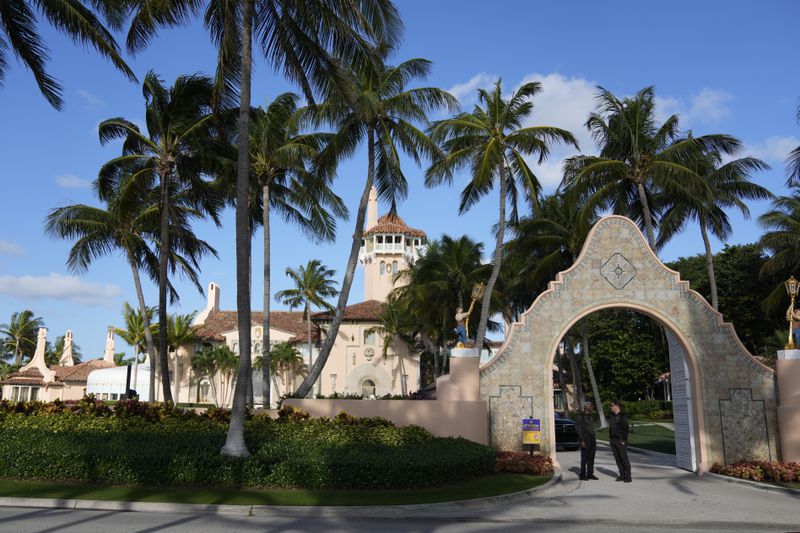 FILE - Security agents talk at the entrance to former President Donald Trump's Mar-a-Lago estate, March 31, 2023, in Palm Beach, Fla. (AP Photo/Rebecca Blackwell, File)