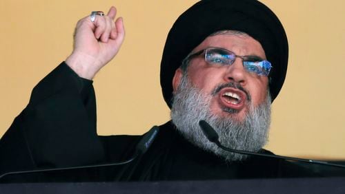 FILE - In this Oct. 24, 2015 file photo, Hezbollah leader Sheik Hassan Nasrallah addresses a crowd during the holy day of Ashoura, in a southern suburb of Beirut, Lebanon. (AP Photo/Hassan Ammar, File)