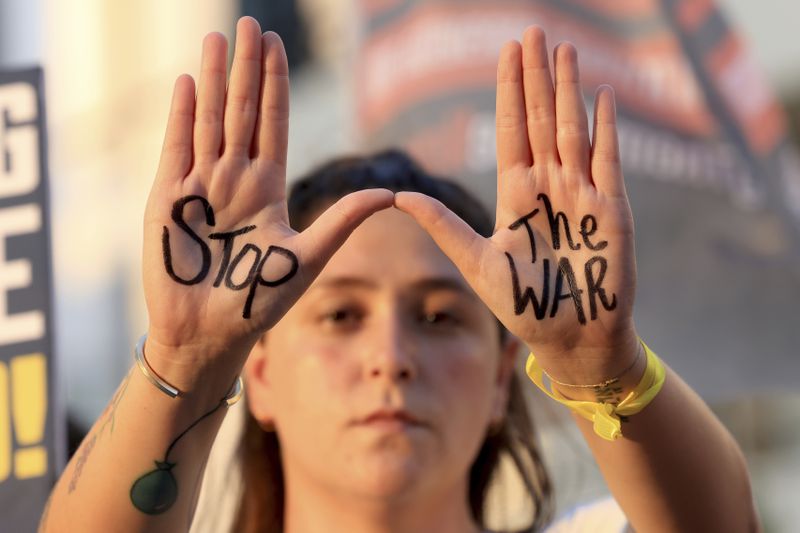 Supporters of hostages who were kidnapped during the deadly October 7 attack attend a protest near the hotel where U.S. Secretary of State Antony Blinken is staying during his visit in Tel Aviv, Monday, Aug. 19, 2024. (Kevin Mohatt/Pool Photo via AP)