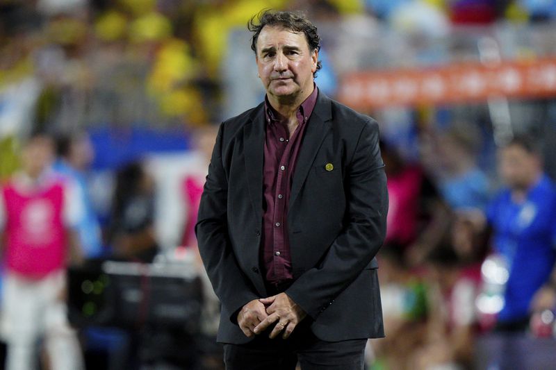 Colombia's coach Nestor Lorenzo watches his team playing Uruguay in a Copa America semifinal soccer match in Charlotte, N.C., Wednesday, July 10, 2024. (AP Photo/Jacob Kupferman)