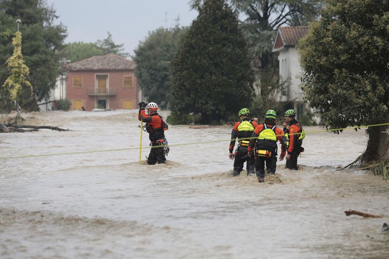 Rescue staff check a flooded area in Bagnacavallo, in the region of Emilia Romagna, Italy, Thursday, Sept. 19, 2024. (Fabrizio Zani/LaPresse via AP)