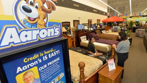Metro Atlanta-based rental giant Aaron’s, shown in this 2013 photo, leases furniture, appliances and electronics to customers around the nation and in Canada. Recently the company was sued in Cobb County over claims that it sold a bill collector accounts that weren’t valid. HYOSUB SHIN / HSHIN@AJC.COM