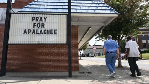 A sign in downtown Winder shows community support for Apalachee High School on Sept. 6. (Hyosub Shin/AJC)