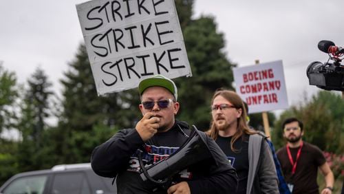 International Aerospace Machinists union members march toward the union's hall to vote on a contract offer with airplane maker Boeing, on Thursday, Sept. 12, 2024, in Renton, Wash. (AP Photo/Stephen Brashear)