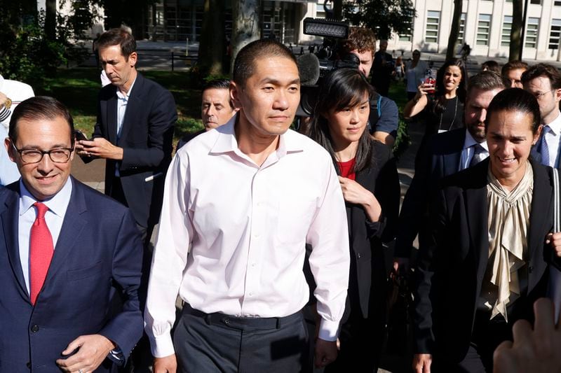 Attorney Seth DuCharme, left, walks with former New York Governor Kathy Hochul aide Linda Sun, center right, and her husband, Christopher Hu, center leave Brooklyn Federal Court after their arraignment, Tuesday, Sept. 3, 2024, in New York. Sun is charged with being an aide to the Chinese government. (AP Photo/Corey Sipkin)