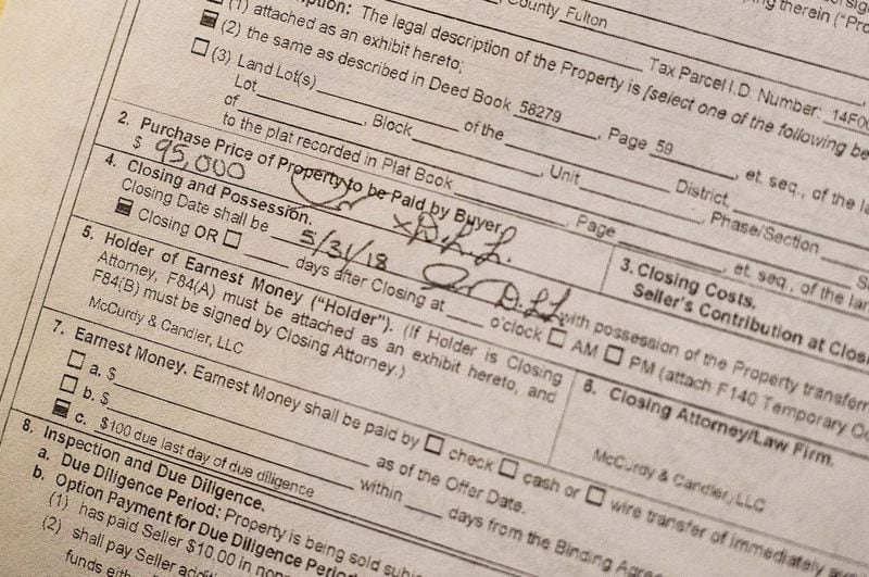 Complaints about real estate wholesalers have skyrocketed in recent years. Often, seniors call Atlanta Legal Aid Society for help after they sign a sales contract, making it difficult to help them. West Atlanta resident Debbie McGauley signed this contract after 20 minute meeting with an investor, she said. ALYSSA POINTER / ALYSSA.POINTER@AJC.COM