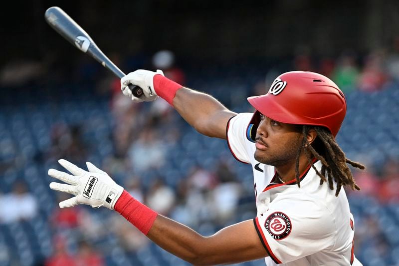 Washington Nationals' James Wood follows through on a double during the first inning of a baseball game against the Atlanta Braves, Tuesday, Sept. 10, 2024, in Washington. (AP Photo/John McDonnell)