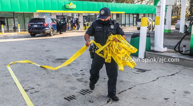 The shooting occurred after a man tracked the stolen car to a BP in northwest Atlanta, authorities said.