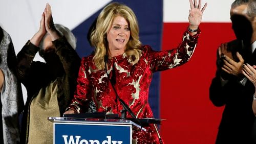 FILE - Then-Texas Democratic gubernatorial candidate Wendy Davis waves to supporters after making her concession speech, Nov. 4, 2014, in Fort Worth, Texas. (AP Photo/Tony Gutierrez, File)