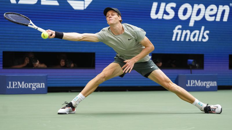 Jannik Sinner, of Italy, returns a shot to Taylor Fritz, of the United States, during the men's singles final of the U.S. Open tennis championships, Sunday, Sept. 8, 2024, in New York. (AP Photo/Kirsty Wigglesworth)