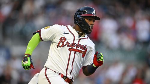 Atlanta Braves outfielder Michael Harris II (23) hits an RBI double to scores Atlanta Braves designated hitter Marcell Ozuna (20) during the second inning at Truist Park in Atlanta on Tuesday, April 23, 2024. (Hyosub Shin / AJC)