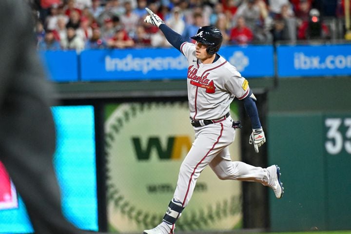 Atlanta Braves’ Austin Riley celebrates after a solo home run against the Philadelphia Phillies during the fourth inning of NLDS Game 4 at Citizens Bank Park in Philadelphia on Thursday, Oct. 12, 2023.   (Hyosub Shin / Hyosub.Shin@ajc.com)
