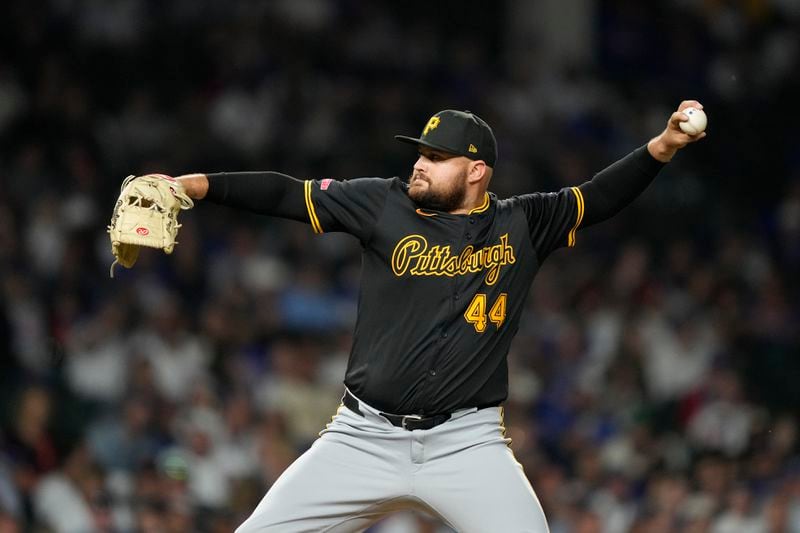 Pittsburgh Pirates position player Rowdy Tellez throws during the eighth inning of a baseball game against the Chicago Cubs on Wednesday, Sept. 4, 2024, in Chicago. (AP Photo/Charles Rex Arbogast)