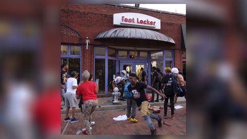 Looters steal from a Foot Locker Store  in downtown Atlanta as protests continued for a fourth day.  Protests over the death of George Floyd in Minneapolis police custody continued around the United States, as his case renewed anger about others involving African Americans, police and race relations.