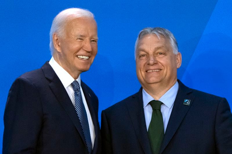 President Joe Biden, left, greets Viktor Orban, Prime Minister of Hungary, as he arrives for a welcome ceremony at the NATO summit in Washington, Wednesday, July 10, 2024. (AP Photo/Mark Schiefelbein)